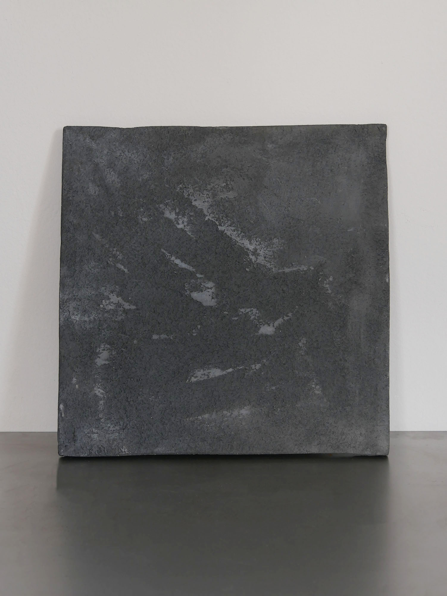 Fired clay wall plate, textured