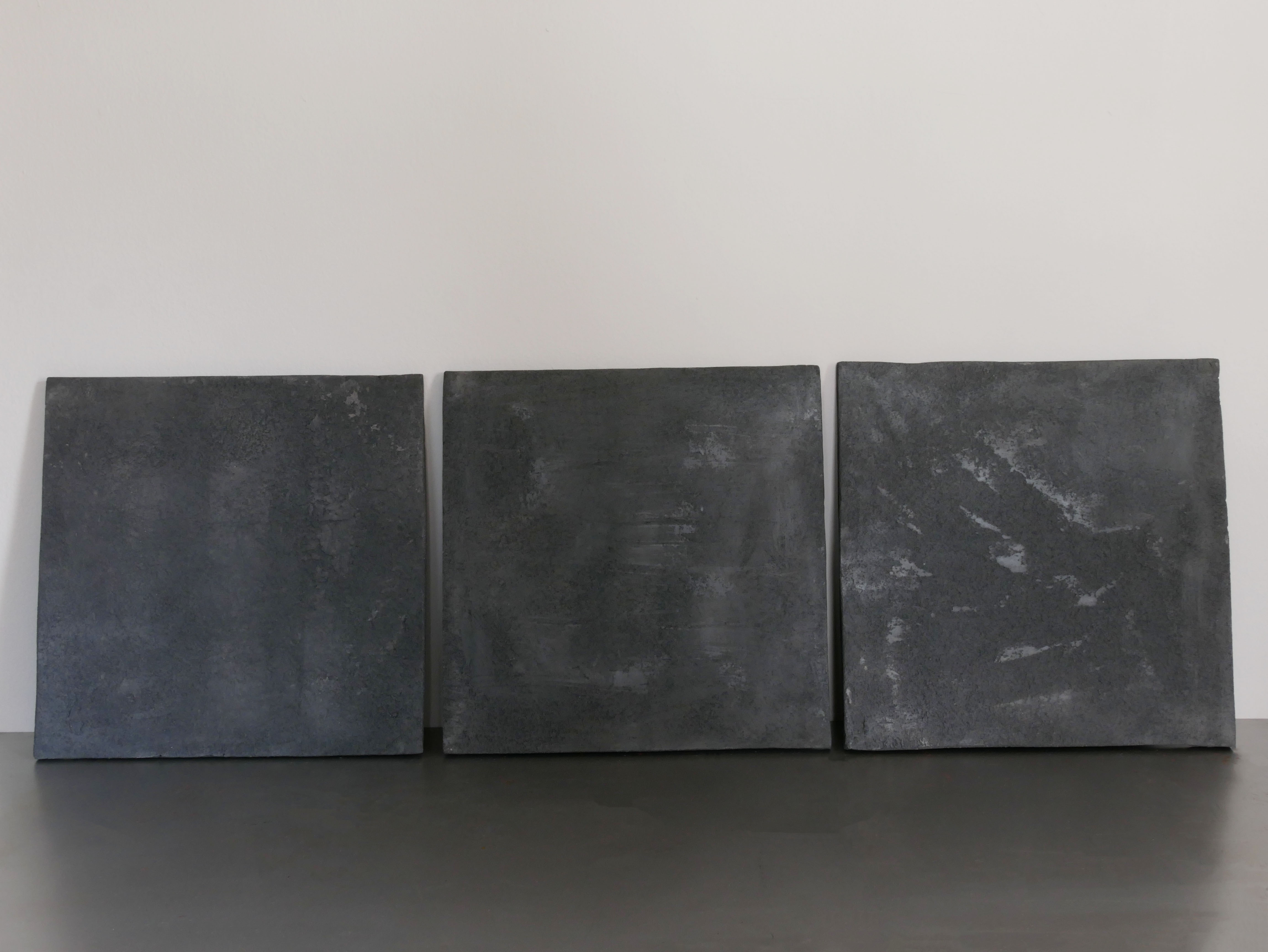 Three fired clay wall plates, one firing